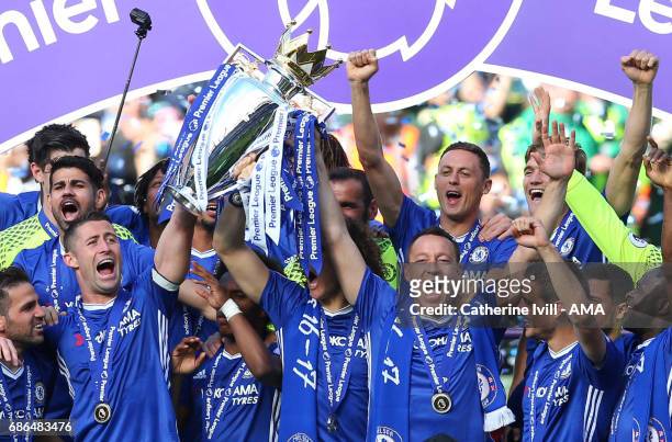 John Terry of Chelsea lifts the Premier League trophy after the Premier League match between Chelsea and Sunderland at Stamford Bridge on May 21,...