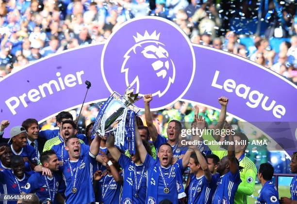 John Terry of Chelsea and his team mates celebrate with the Premier League trophy during the Premier League match between Chelsea and Sunderland at...