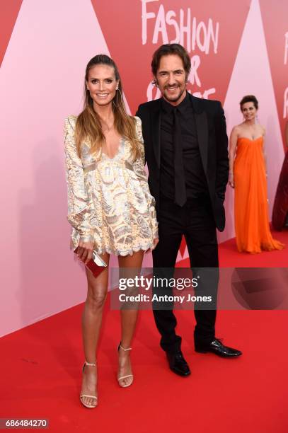 Heidi Klum and Thomas Hayo attend the Fashion for Relief event during the 70th annual Cannes Film Festival at Aeroport Cannes Mandelieu on May 21,...