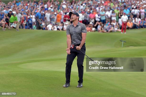 Jason Day of Australia reacts to a missed putt in a playoff against Billy Horschel on the 18th hole during the Final Round of the AT&T Byron Nelson...