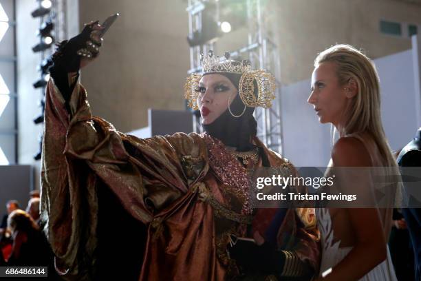 Daniel Lismore and Lady Victoria Hervey pose for a selfie backstage at the Fashion for Relief event during the 70th annual Cannes Film Festival at...