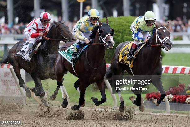 Classic Empire with jockey Julien Leparoux aboard and Always Dreaming with John Velazquez up head into the first turn as Cloud Computing and Javier...