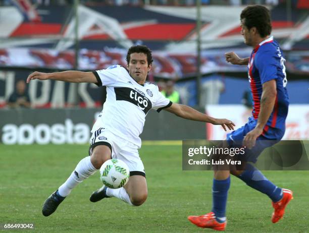 Cristian Riveros of Olimpia fights for the ball with Nelson Haedo Valdez of Cerro Porteño during a match between Olimpia and Cerro Porteño as part of...