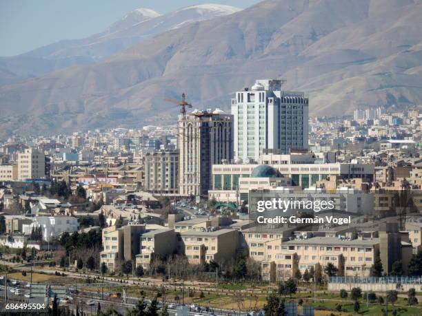 tehran clean city skyline and urban development of iran, with the ministry of health and medical education building above all - tehran skyline stock pictures, royalty-free photos & images