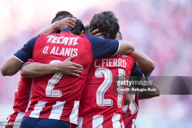 Oswaldo Alanis and Carlos Fierro of Chivas celebrate after a goal scored by their teammate Nestor Calderon during the semi final second leg match...