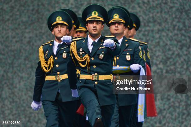 Members of the Azerbaijani Army carry flags ahead of the Women's Freestyle 69kg Wrestling medals ceremony during Baku 2017 - 4th Islamic Solidarity...
