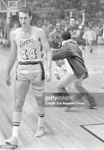 Jerry West of the Los Angeles Lakers walks off the court after the Boston Celtics beat the Lakers in Game 7 of the NBA Championships at The Forum on...
