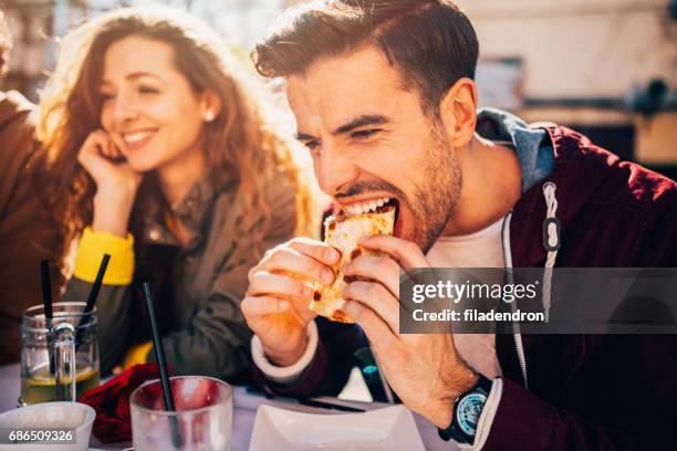 man eating at a restaurant - social bite stock pictures, royalty-free photos & images