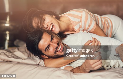 Happy young couple in bed Happy young couple in bed