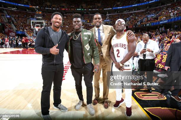 Cleveland Browns first round draft picks Jabrill Peppers , David Njoku , Myles Garrett pose for a picture with TNT analyst Chris Webber at the game...