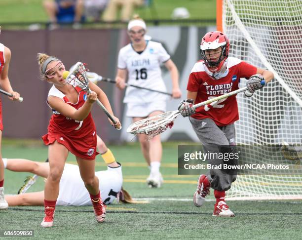 Sara Rheinsmith of Florida Southern College comes up with the ball as teammate goalie Taylor Gillis looks on during the Division II Women's Lacrosse...