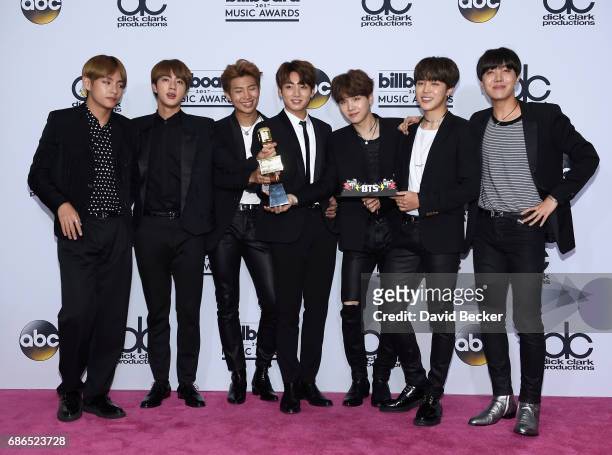 Music group BTS, winner of the Top Social Artist award, pose in the press room during the 2017 Billboard Music Awards at T-Mobile Arena on May 21,...