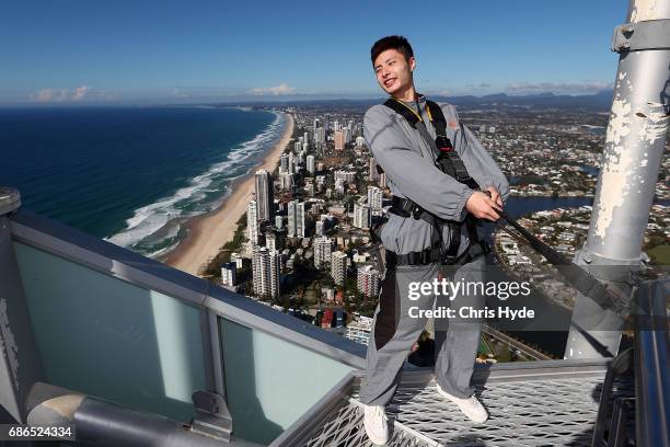 Badminton player Shi Yuqi of China poses on the Skydeck walk at the Skypoint Observation Deck on May 22, 2017 in Gold Coast, Australia. Today,...