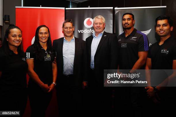 New Zealand womens rugby player Portia Woodman and All Blacks player Jerome Kaino pose for a photo with Vodafone Chief Executive Russell Stanners and...