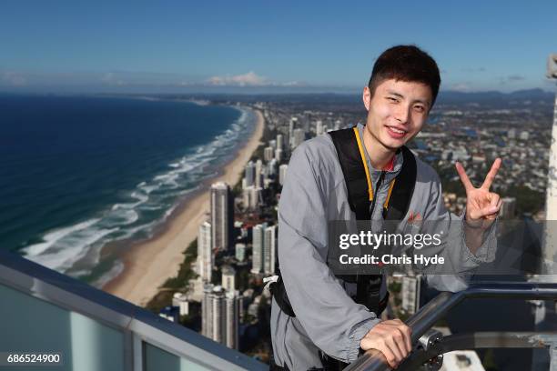 Badminton player Shi Yuqi of China poses on the Skydeck walk at the Skypoint Observation Deck on May 22, 2017 in Gold Coast, Australia. Today,...