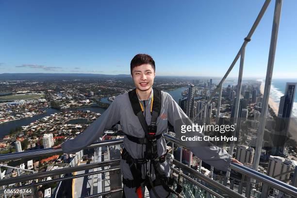 Badminton player Shi Yuqi of China poses on the Skydeck walk at the Skypoint Observation Deck on May 22, 2017 in Gold Coast, Australia. Today,...