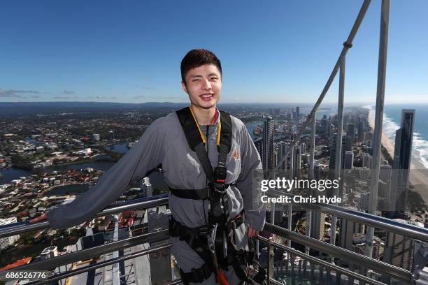 Badminton player Shi Yuqi of China poses on the Skydeck walk at the Skypoint Observation Deck on May 22, 2017 in Gold Coast, Australia. Today,...