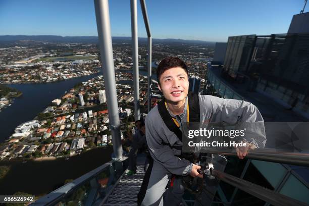 Badminton player Shi Yuqi of China poses on the Skydeck walk at the Skypoint Observation Deck on May 22, 2017 in Gold Coast, Australia. Today,...