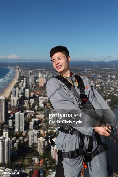 Badminton player Shi Yuqi of China poses on the Skydeck walk at the Skypoint Observation Deck on May 22, 2017 in Gold Coast, Australia. Today,...