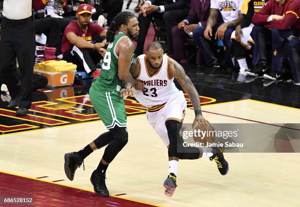 LeBron James of the Cleveland Cavaliers drives against Jae Crowder of the Boston Celtics in the third quarter during Game Three of the 2017 NBA...