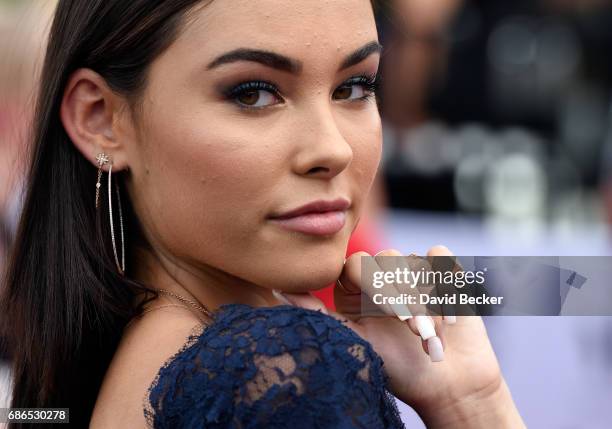 Madison Beer poses at SiriusXM's "Hits 1 in Hollywood" red carpet broadcast on SiriusXM's SiriusXM Hits 1 channel before the Billboard Music Awards...