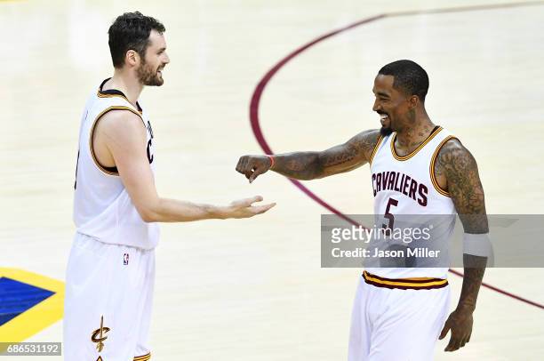 Kevin Love celebrates with JR Smith of the Cleveland Cavaliers in the second quarter against the Boston Celtics during Game Three of the 2017 NBA...