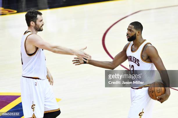 Kevin Love celebrates with Tristan Thompson of the Cleveland Cavaliers in the second quarter against the Boston Celtics during Game Three of the 2017...