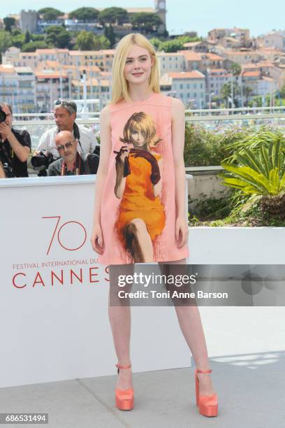 Elle Fanning attends the "How To Talk To Girls At Parties" Photocall during the 70th annual Cannes Film Festival at Palais des Festivals on May 21,...