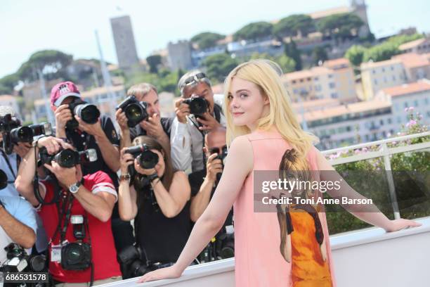 Elle Fanning attends the "How To Talk To Girls At Parties" Photocall during the 70th annual Cannes Film Festival at Palais des Festivals on May 21,...