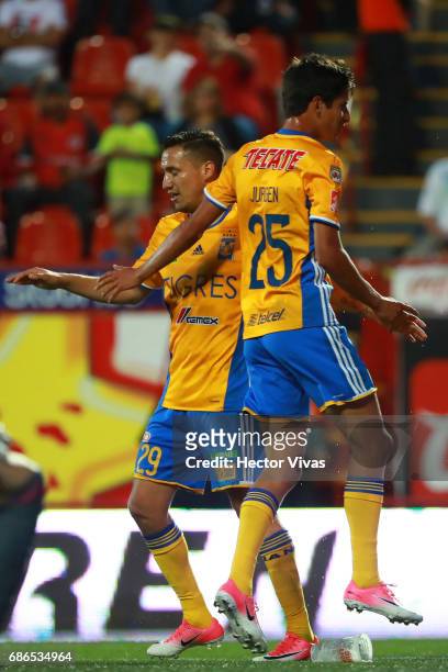 Jurgen Damm of Tigres celebrates with Jesus Dueñas after scoring the second goal of his team during the semi final second leg match between Tijuana...