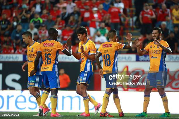 Jurgen Damm of Tigres celebrates with Luis Advincula after scoring the second goal of his team during the semi final second leg match between Tijuana...