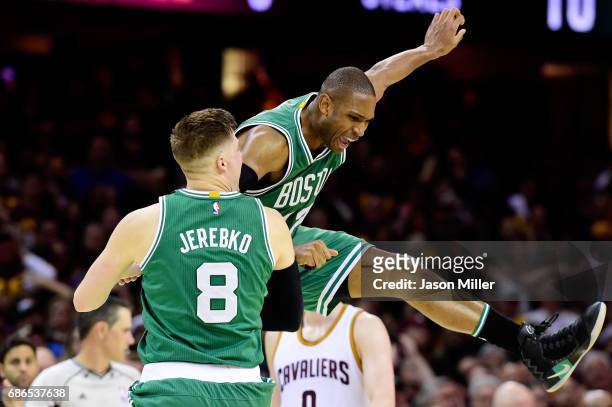 Al Horford celebrates with Jonas Jerebko of the Boston Celtics after their 111 to 108 win over the Cleveland Cavaliers during Game Three of the 2017...