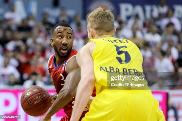 Dru Joyce of Munich und Niels Giffey of Berlin battle for the ball during the easyCredit BBL Basketball Bundesliga match between FC Bayern Muenche...