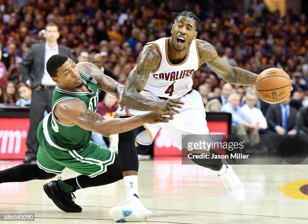 Marcus Smart of the Boston Celtics fouls Iman Shumpert of the Cleveland Cavaliers in the second half during Game Three of the 2017 NBA Eastern...