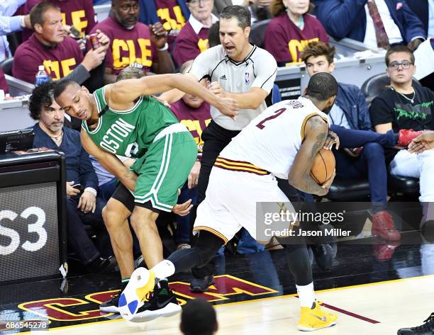 Avery Bradley of the Boston Celtics and Kyrie Irving of the Cleveland Cavaliers collide in the second half during Game Three of the 2017 NBA Eastern...