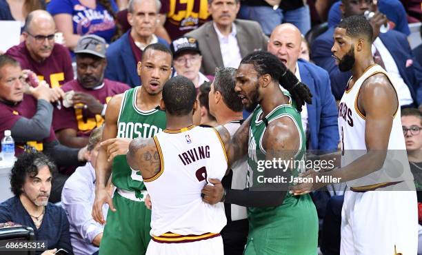 Avery Bradley of the Boston Celtics and Kyrie Irving of the Cleveland Cavaliers exchange words in the second half during Game Three of the 2017 NBA...