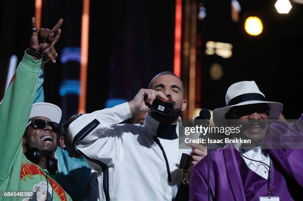 Drake takes a shot of Virginia Black Whiskey to celebrate winning the Billboard Artist of the Year Award at T-Mobile Arena on May 21, 2017 in Las...