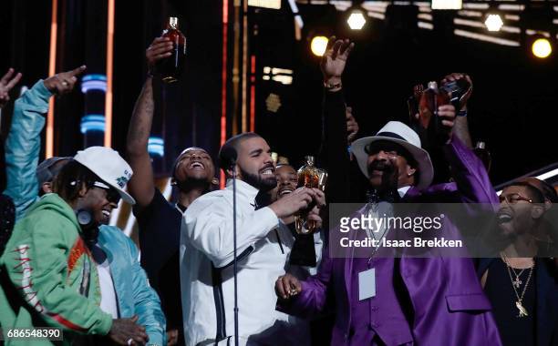 Drake takes a shot of Virginia Black Whiskey to celebrate winning the Billboard Artist of the Year Award at T-Mobile Arena on May 21, 2017 in Las...