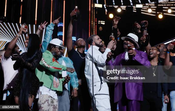 Drake takes a shot of Virginia Black Whiskey to celebrate winning the Billboard Artist of the Year Award at T-Mobile Arena on May 21, 2017 in Las...