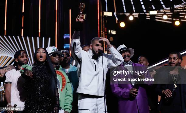 Drake takes a shot of Virginia Black Whiskey to celebrate winning the Billboard Artist of the Year Award at T-Mobile Arena on May 21, 2017 in Las...