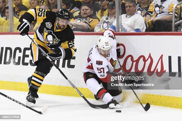 Ottawa Senators center Tommy Wingels moves the puck as Pittsburgh Penguins Defenseman Ron Hainsey defends during the first period in Game Five of the...