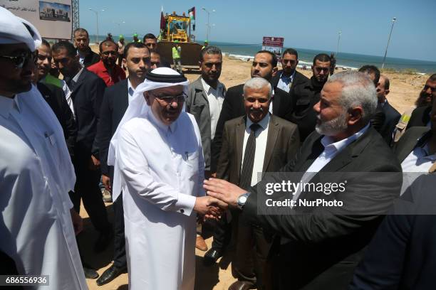Ismail Haniyeh, leader of Hamas and Qatar's Ambassador to the Palestinian Authority, Mohammed Al Emadi attend the ceremony of establishment of the...