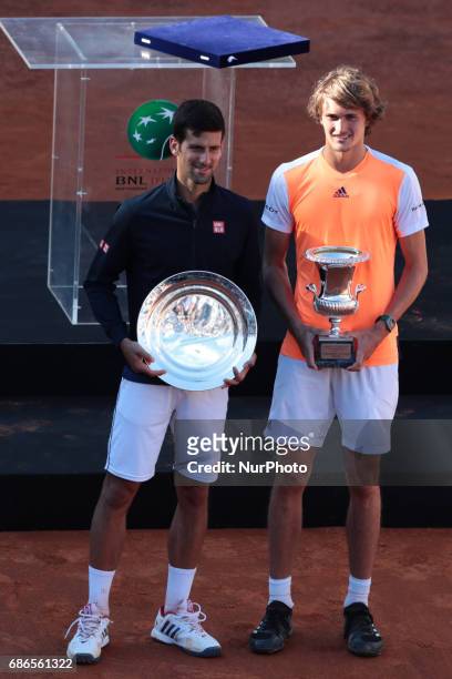 Alexander Zverev of Germany poses with the trophy after winning the ATP Tennis Open final against Novak Djokovic of Serbia on May 21 at the Foro...