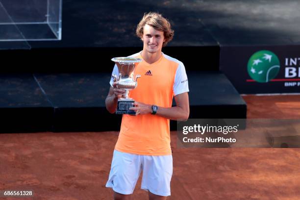 Alexander Zverev of Germany poses with the trophy after winning the ATP Singles Final match between Alexander Zverev of Germany and Novak Djokovic of...