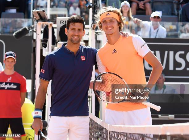 Alexander Zverev of Germany poses with the trophy after winning the ATP Tennis Open final against Novak Djokovic of Serbia on May 21 at the Foro...