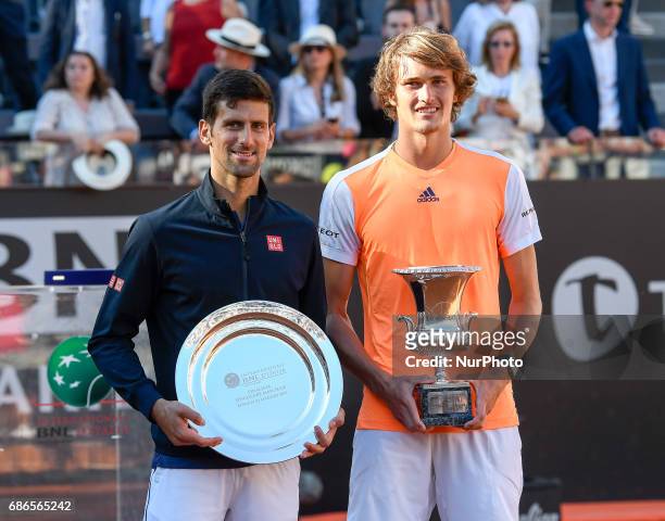 Alexander Zverev of Germany poses with the trophy after winning the ATP Tennis Open final against Novak Djokovic of Serbia on May 21 at the Foro...
