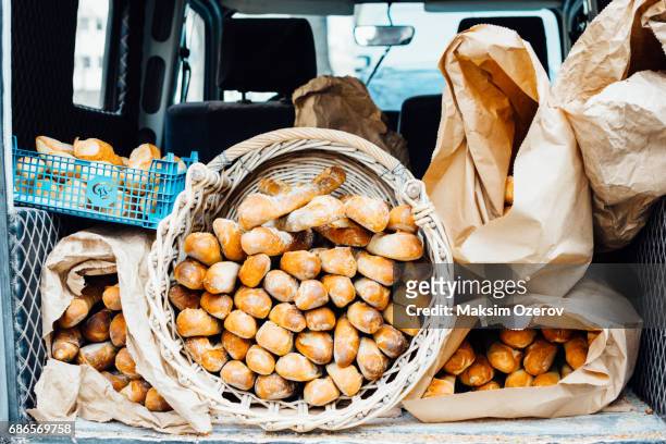 car carrying baguettes in paris, france - paris food stock pictures, royalty-free photos & images
