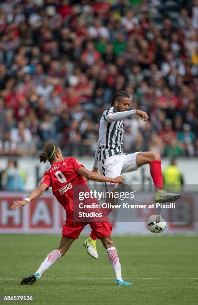 Forward Yussuf Yurary Poulsen of RB Leipzig and Defense Michael Hector of Eintracht Frankfurt fighting for the ball at the Commerzbank Arena during...