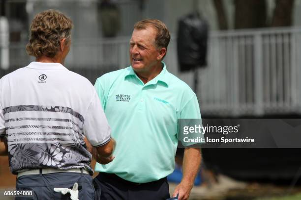 Fred Funk congratulates Bernhard Langer after the final round of the 2017 Regions Tradition during the final round of the 2017 PGA Champions Tour...