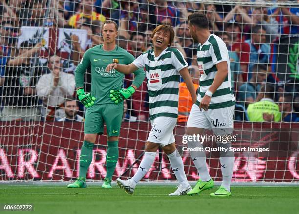 Takashi Inui of Eibar celebrates with his teammate after scoring the opening goal during the La Liga match between FC Barcelona and SD Eibar at Camp...